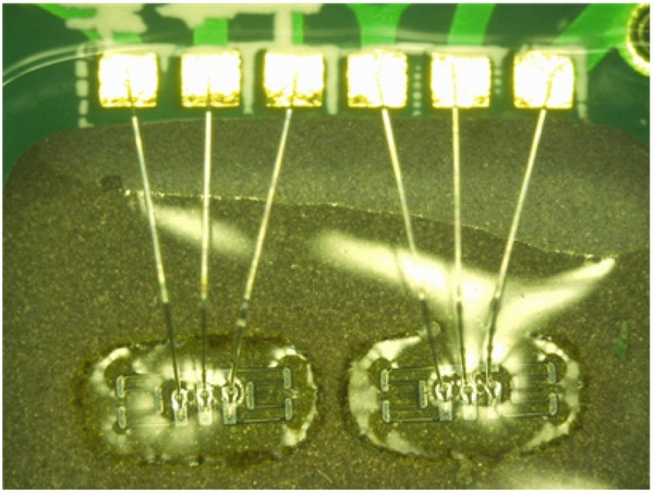 Silicon strain gages bonded on stainless steel using glass frit for ...