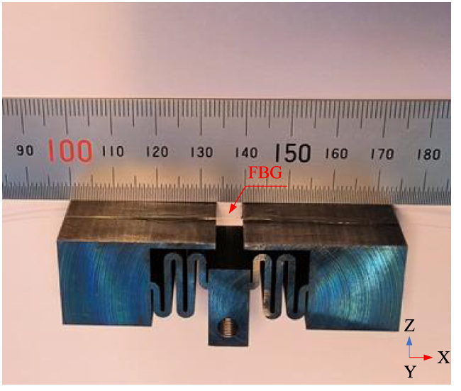 High sensitivity optical fiber accelerometer based on symmetric hinge ...