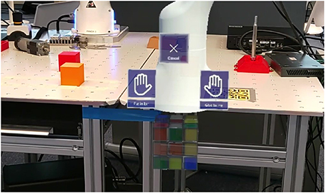 A shared robot control system combining augmented reality and motor ...